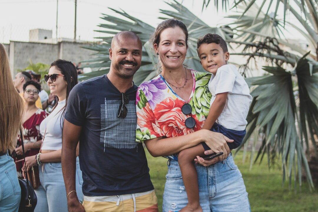 Brazilian friends smiling and talking together on a sofa