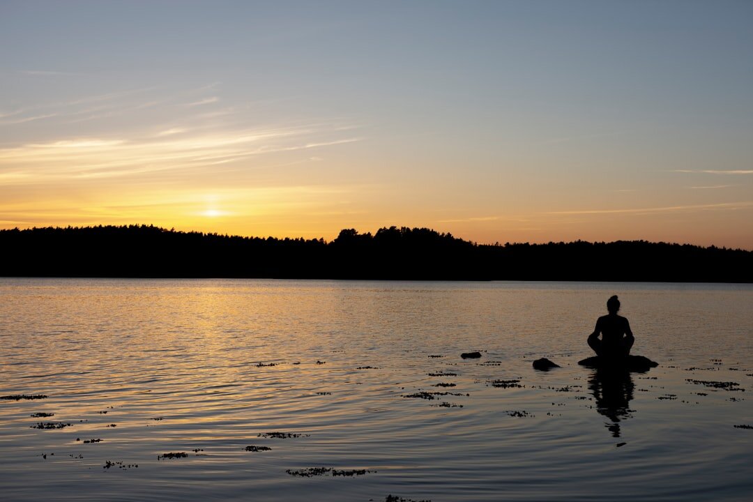 person meditating alone