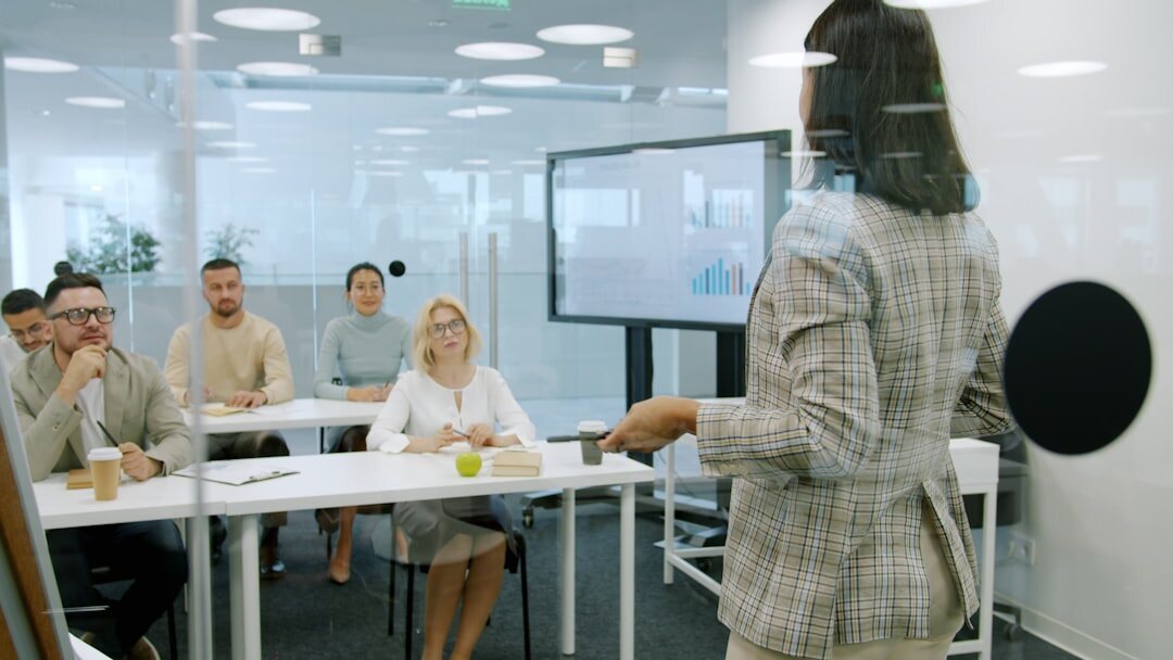 businesswoman presenting to team