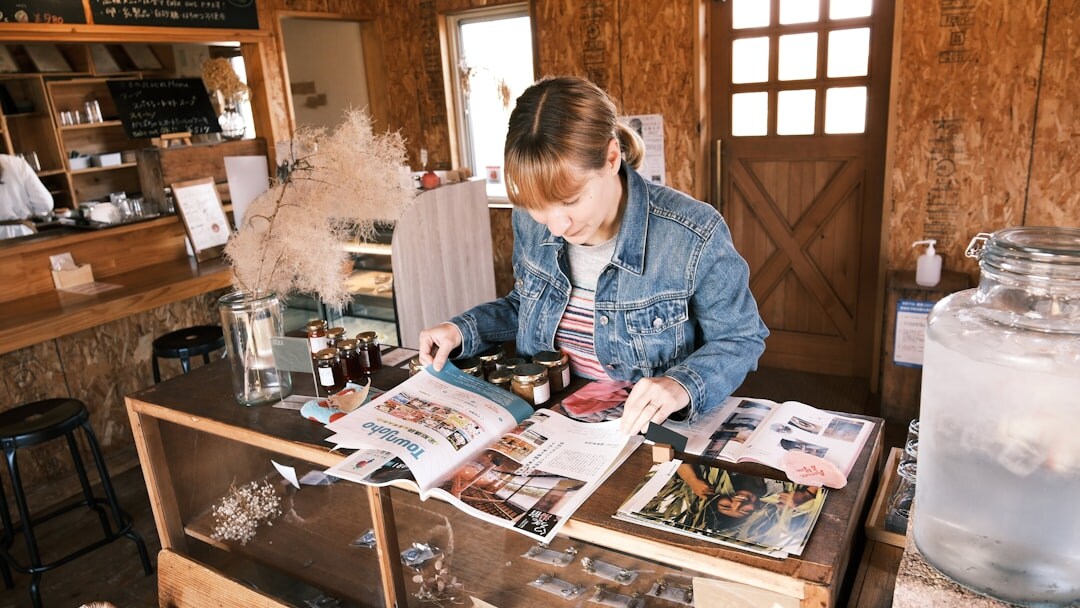 woman journaling in cafe