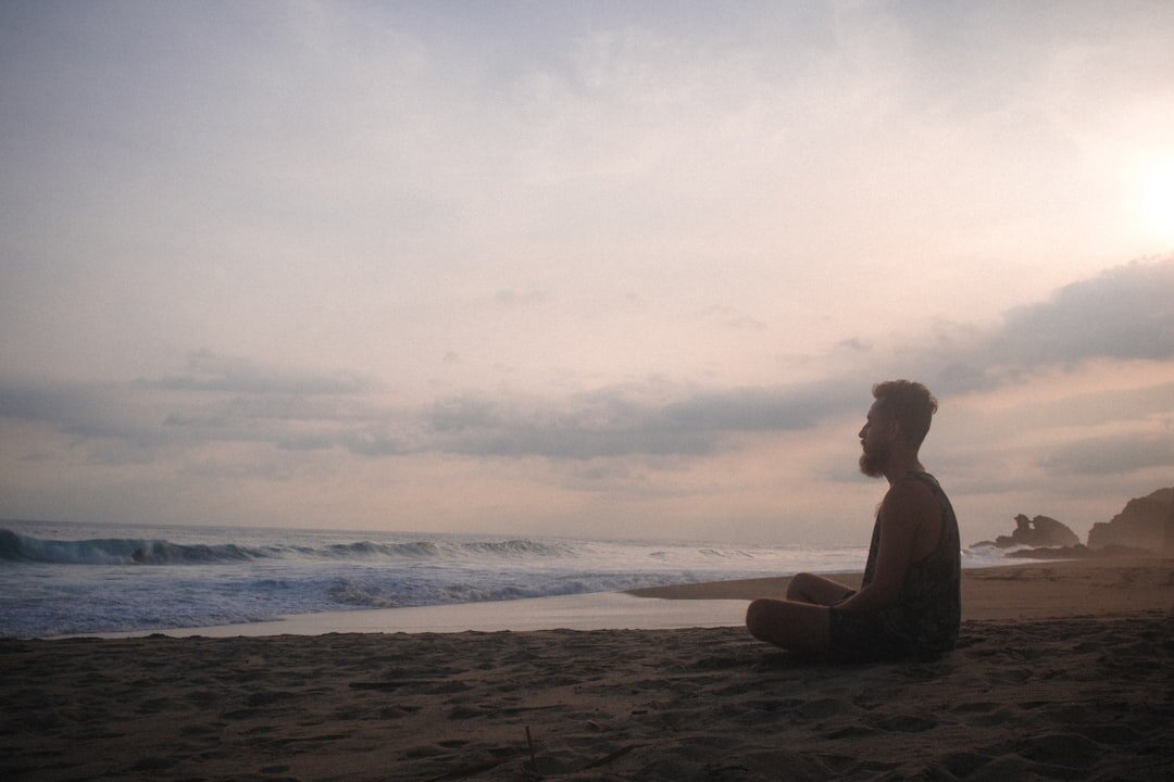 person meditating alone